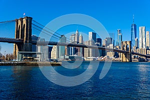 Lower Manhattan Downtown skyline panorama from Brooklyn Bridge Park riverbank, New York City, USA