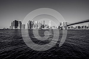 Lower Manhattan Downtown skyline panorama from Brooklyn Bridge Park riverbank, New York City, USA