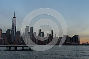 Lower Manhattan New York City Skyline seen from the Jersey City Waterfront with a Helipad during a Sunset