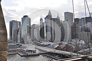 Lower Manhattan panorama from Brooklyn Bridge over East River from New York City in United States