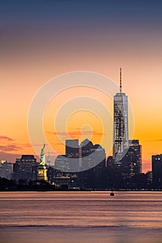 Lower Manhattan and the Statue of Liberty at sunrise