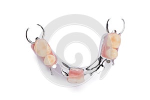Lower metal denture on a white background