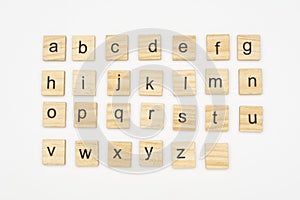 Lowercase alphabet letters on scrabble wooden blocks