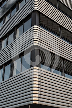 lowered blinds at the sunny side of a building