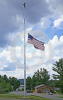 Lowered, half-mast American flag on flagpole