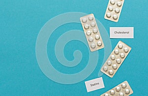 Statin tablets on a blue background photo