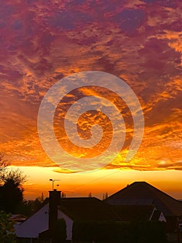 Lowering sun turns clouds into bubbling mass of cloud into molten gold