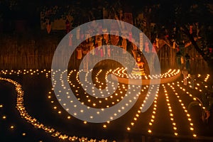 Loy Krathong festival ,Buddhist monk light candles to the Buddha in Phan-Tao Temple, Chiangmai, Thailand