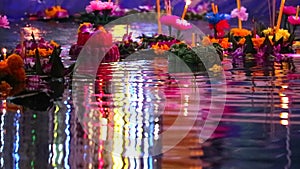 Loy Kratong Festival reflection light on the water surface, Some evidence is believed to be the worship of the Buddha`s footprint