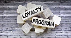 Loyalty program text on wooden blocks