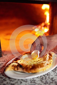 Lozhit cook egg yolk in Ajarian khachapuri. Preparation.