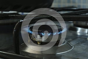 Lpg propane gas cooker close up while burning,not renewable energy wastage