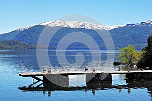 lpicturesque image in summer trees and gardens old wooden pier mountain, san martin de los andes neuquen argentina -