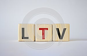 LTV - Life Time Value symbol. Concept word LTV on wooden cubes. Beautiful white background. Business and LTV concept. Copy space