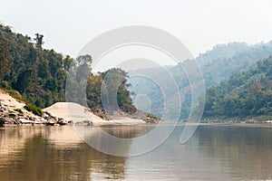 Luang Prabang, Laos - Mar 04 2015: Slow boat cruise on the Mekong River. Popular tourist adventure trip by slow boat from