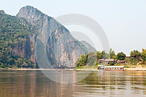 Luang Prabang, Laos - Mar 04 2015: Slow boat cruise on the Mekong River. Popular tourist adventure trip by slow boat from