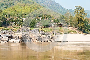 Luang Prabang, Laos - Mar 04 2015: Slow boat cruise on the Mekong River. Popular tourist adventure trip by slow boat from