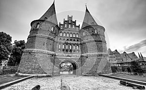 Lubeck, Germany - July 22, 2016: Tourists visit famous Holstentor gate in summer, Schleswig-Holstein, northern Germany