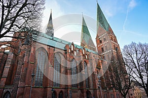 Lubeck Marienkirche St. Mary`s church, a historic brick gothic basilica with two towers built by the merchants of the hanseatic photo