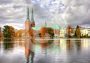Lubeck, old town reflected in Trave river photo