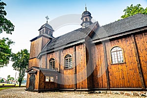 Lubowo, Poland - August 09, 2021. Old wooden st. Mikolaj Church - Kosciol pw. sw. Mikolaja