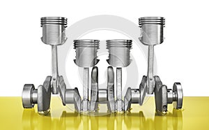 Lubricant concept. Crankshaft with pistons in the oil on a white background