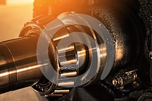 Lubricated roller bearing. Truck suspension repair part. Close-up. Background.