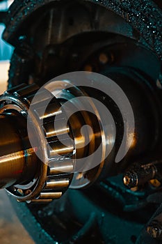 Lubricated roller bearing. Truck suspension repair part. Close-up. Background.