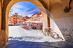 Lucca, Italy - Piazza dell`Anfiteatro, scenic sight of Tuscany photo