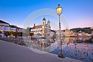 Lucerne church and Reuss river waterfront dawn view