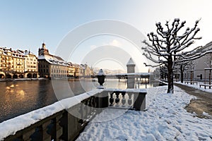 Lucerne, Switzerland, February 4, 2019: Old town of Lucerne with reuss river and water tower on a cold winter morning during