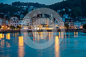 Lucerne, Switzerland, on sunset. View of the old town over river Reuss