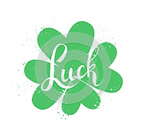 Luck hand drawn lettering on green clover leaf isolated on white background. Traditional symbol of St. Patrick`s Day holiday. -