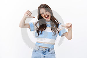 Lucky ambitious optimistic good-looking excited woman bragging win, pointing herself sassy smiling, cheerfully dancing photo
