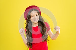 Lucky and beautiful. Kid girl long healthy shiny hair wear red hat. Little girl with long hair. Kid happy cute face