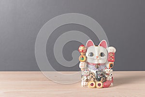 Lucky cat on wooden table