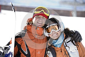 Lucky couple snowboarders