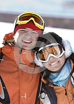 Lucky couple snowboarders in a mountain