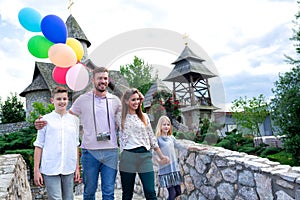 Lucky family crossing the stone bridge