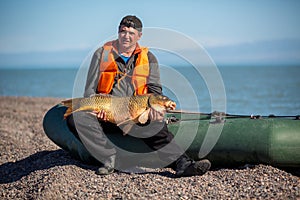 Lucky fisherman holding a beautiful trophy fish