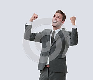 Lucky handsome businessman celebrating. Winner laughing man