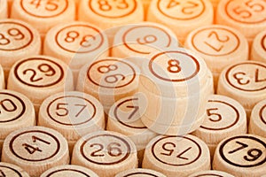 Lucky number 8 on the background of wooden keg lotto. Close up