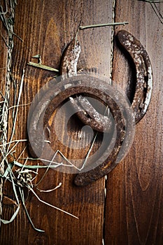 Lucky old  horseshoes laying at wooden floor