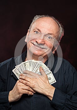 Lucky old man with dollar bills