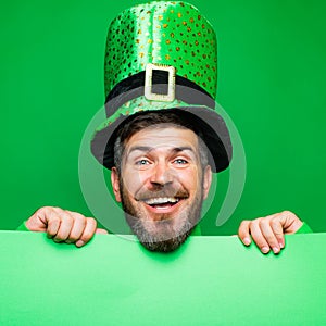 Lucky Patricks day. Man on green background celebrate St Patricks Day. Man in Saint Patrick`s Day leprechaun party hat