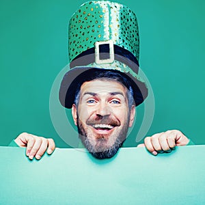 Lucky Patricks day. Man on green background celebrate St Patricks Day. Man in Saint Patrick`s Day leprechaun party hat