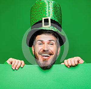 Lucky Patricks day. Man on green background celebrate St Patricks Day. Man in Saint Patrick's Day leprechaun party photo