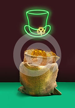 Lucky treasure minimal concept. Bag full of golden coins. Green Neon sign of top hat with yellow fluorescent cloves buckle. Plum