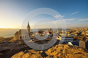 Luderitz in Namibia with lutheran church called Felsenkirche at sunset