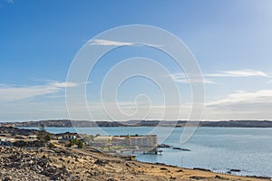 Luderitz Nest Hotel overlooking a tranquil sea in the rugged, rocky terrain of Luderitz, Namibia